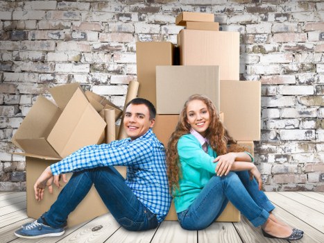 Office furniture and files prepared for transport during a commercial relocation