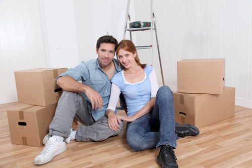 Careful packing of fragile household items for relocation